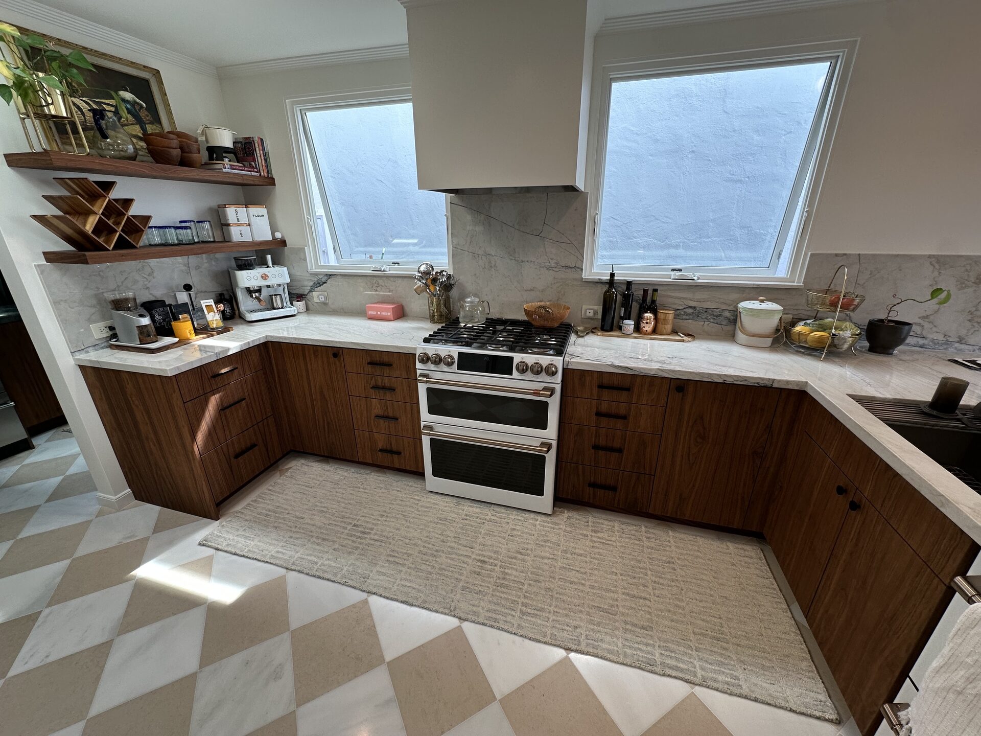 Primary finished-room view of walnut peninsula kitchen cabinetry and surrounding surfaces
